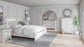 Altyra King Panel Bookcase Bed with Mirrored Dresser, Chest and Nightstand