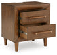 Lyncott Queen Upholstered Bed with Mirrored Dresser and Nightstand